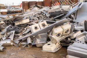 pile of mixed metal scrap waiting to be processed at a recycling facility in Sydney